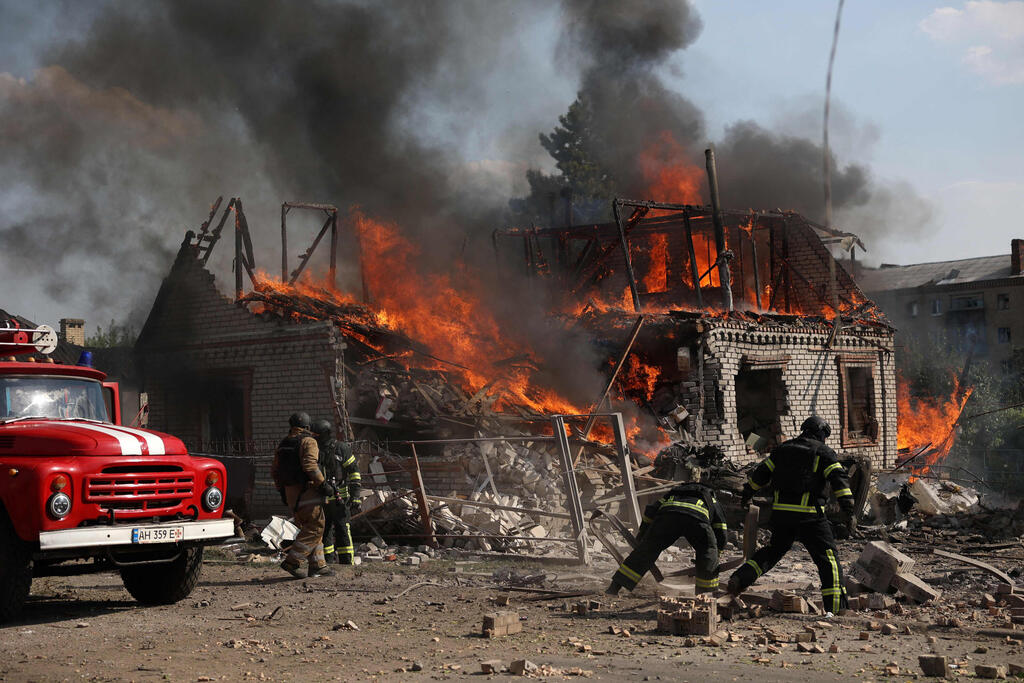  Rescuers put out a fire caused by a Russian missile attack in Kostyatynivka town, Donetsk region, on July 21, 2024.