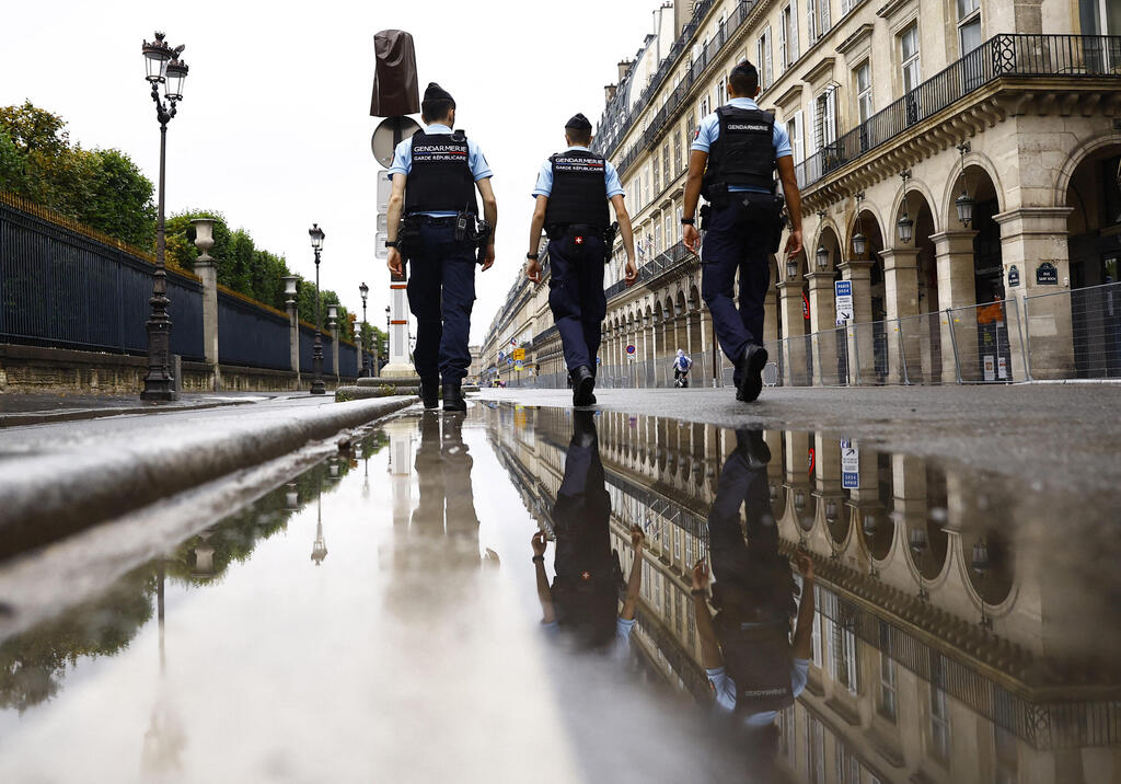 Paris police patrol the streets near the Louvre Museum 