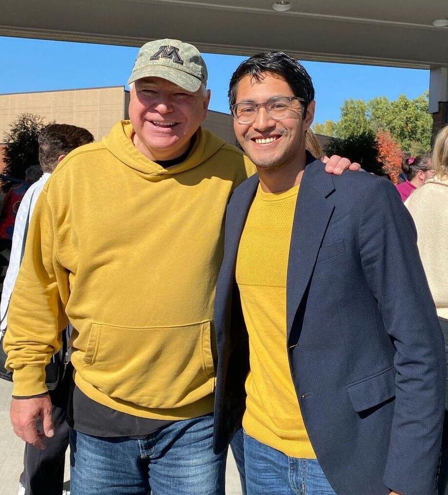 Manilan Houle (R) with Tim Walz 