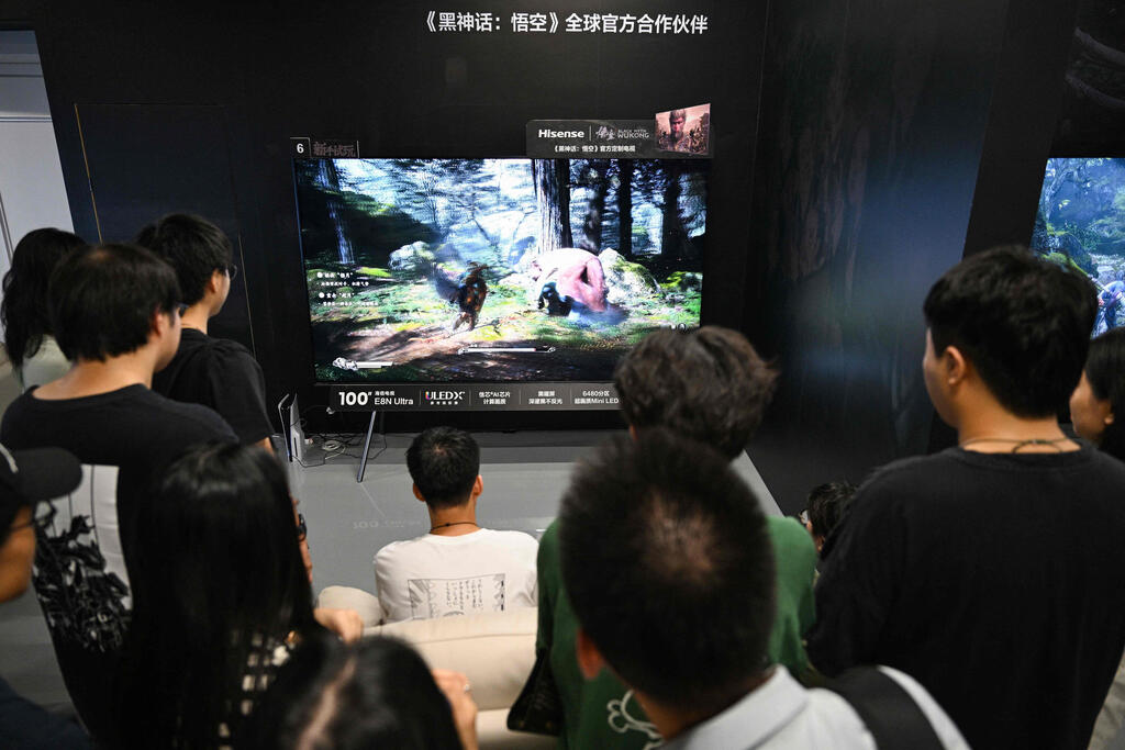 A young man plays Chinese action role-playing game 'Black Myth: Wukong'