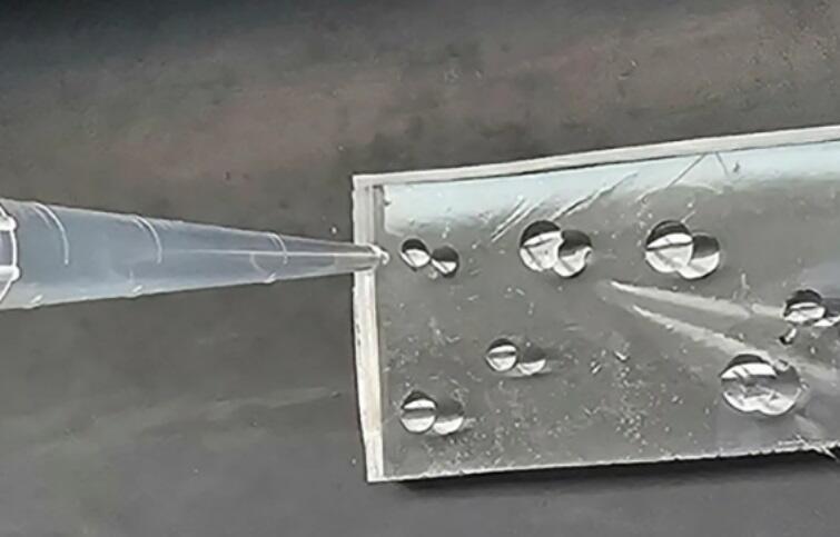 A glassy material with adhesive properties that can self-repair cracks. Tri-Tyrosine 