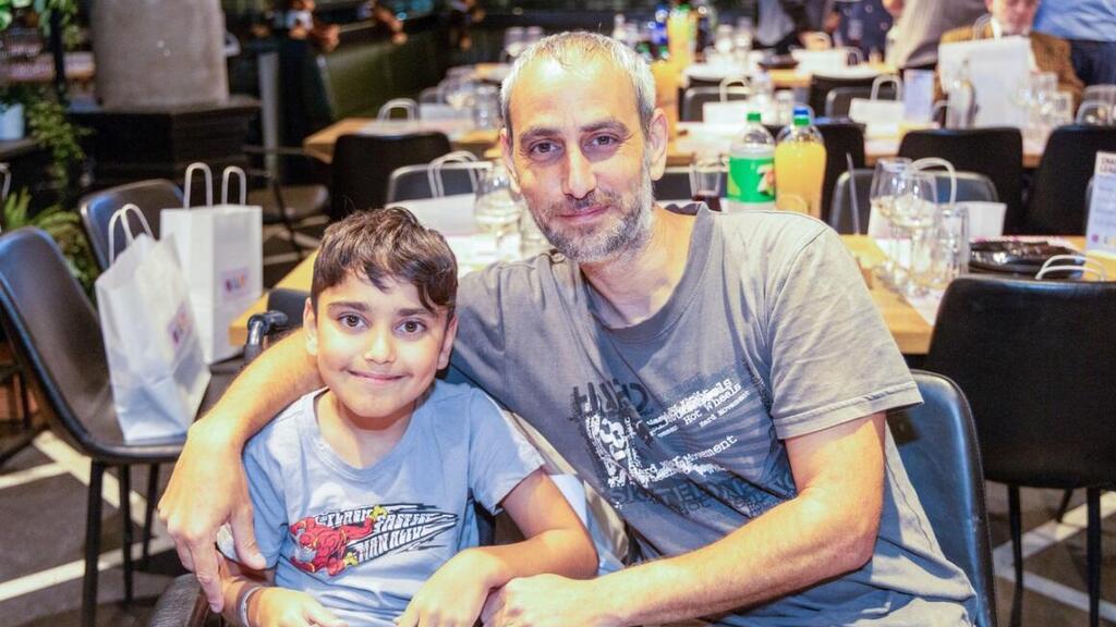Yaheli Aviad and his father, Maor, at the Pitmaster restaurant even (Photo: Menachem Leff/Gilat Foundation) Yaheli Aviad and his father, Maor, at the Pitmaster restaurant even