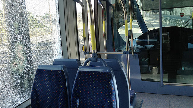 Damage done to the Jerusalem light rail from a Molotov cocktail (Photo: Jerusalem police spokesperson) (צילום: דוברות משטרת מחוז ירושלים) Damage done to the Jerusalem light rail from a Molotov cocktail (Photo: Jerusalem police spokesperson)