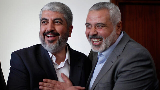 Hamas leaders Khaled Meshal and Ismail Haniyeh meeting in Gaza. (Photo: Reuters) (צילום: רויטרס) Hamas leaders Khaled Meshal and Ismail Haniyeh meeting in Gaza. (Photo: Reuters)