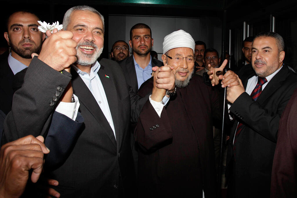 Egyptian Sheikh Yusuf al-Qaradawi with Hamas' Ismail Haniyeh 