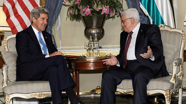 US Secretary of State John Kerry (left) with Palestinian President Mahmoud Abbas. (Photo: AP)