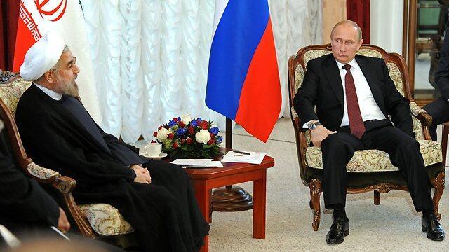 Russian President Putin with Iranian President Rouhani (Photo: AP)