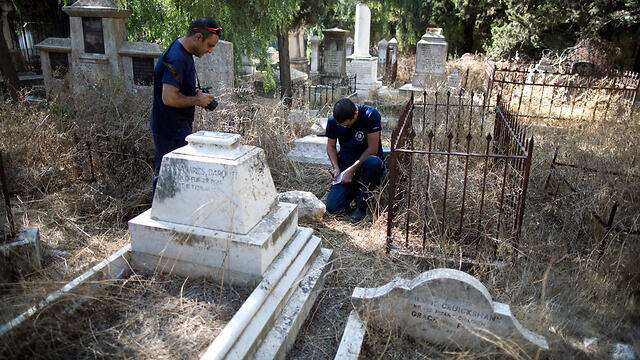 Christian tombstones vandalized (Photo: EPA) (צילום: EPA) Christian tombstones vandalized (Photo: EPA)