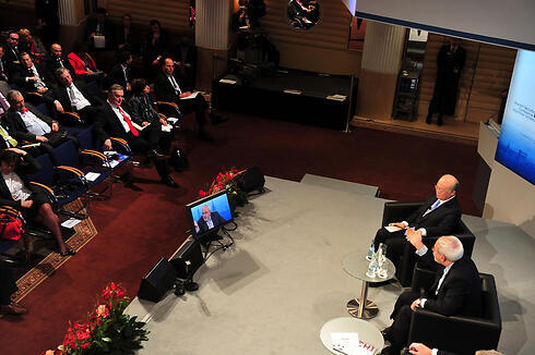Defense Minister Ya'alon stays in plenary hall as Iranian Foreign Minister addresses conference. Photo: Ariel Hermoni