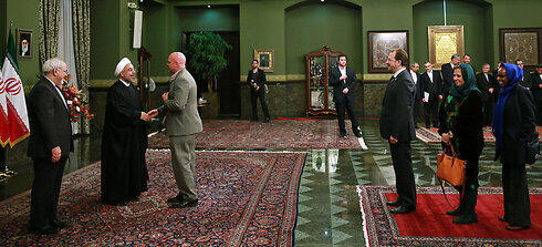 Rouhani greeing foreign ambassadors in Tehran (Photo: AP)