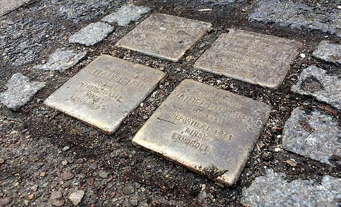 The 'stumbling blocks' commemorating family's name at the entrance to the building 