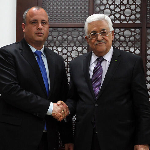 Abbas with Labor MK Yehiel (Hilik) Bar (Photo: AFP)