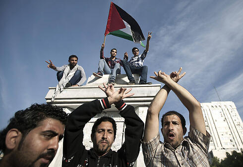 Palestinians in Gaza celebrating the unity accords (Photo: AFP)