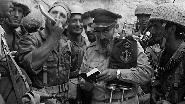 In this 1967 photo, Rabbi Shlomo Goren carries the Torah scroll as he holds the first Jewish prayer session at the Western Wall since 1948 (Reproduction photo: Benny Ron) (צילוםרפרודוקציה: בני רון) In this 1967 photo, Rabbi Shlomo Goren carries the Torah scroll as he holds the first Jewish prayer session at the Western Wall since 1948 (Reproduction photo: Benny Ron)