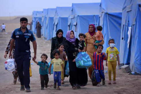 The Iraq crisis already caused a big wave of refugees fleeing areas seized by Islamists (Photo: AFP) (צילום: AFP) The Iraq crisis already caused a big wave of refugees fleeing areas seized by Islamists (Photo: AFP)