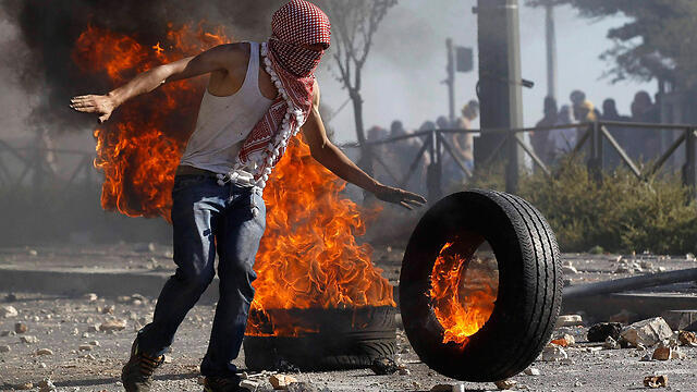 A Palestinian demonstrator this week (Photo: Reuters)