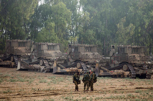 IDF troops and bulldozers after penetrating into Gaza. (Photo: AFP)