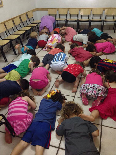 Sderot children take cover during Code Red sirennullnull Sderot children take cover during Code Red siren