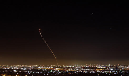 Iron Dome intercepting a rocket over the lights of central Israel. (Photo: Anders Koenig)