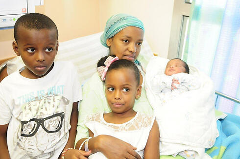 Galaito Kasahun with her children. 'I don't know how to go on from here'. (Photo: Herzl Yosef)