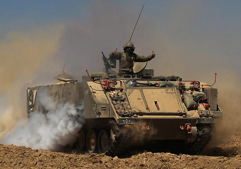An APC used in Operation Protective Edge (Photo: EPA) (צילום: EPA) An APC used in Operation Protective Edge (Photo: EPA)