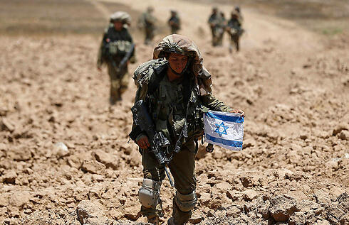 IDF soldiers in Gaza during Operation Protective Edge. (Photo: Reuters) (צילום: רויטרס) IDF soldiers in Gaza during Operation Protective Edge. (Photo: Reuters)