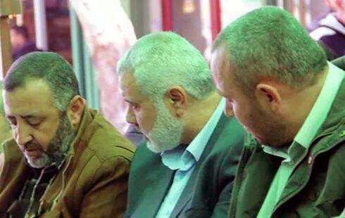 Abu Shmallah (left) with al-Attar (right) and Ismail Haniyeh.nullnull Abu Shmallah (left) with al-Attar (right) and Ismail Haniyeh.