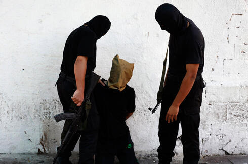 Hamas executes 'collaborators' with Israel during Operation Protective Edge (Photo: Reuters)