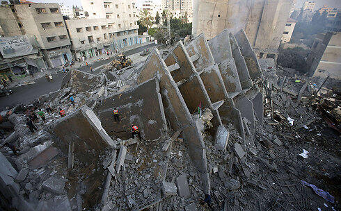 The ruins of a building in Gaza Strip during Operation Protective Edge (Photo: AFP) (צילום: AFP) The ruins of a building in Gaza Strip during Operation Protective Edge (Photo: AFP)