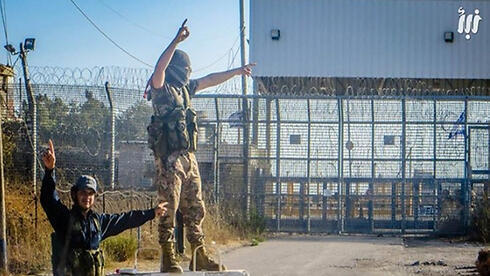 Al-Qaeda rebels celebrating near the Israeli border