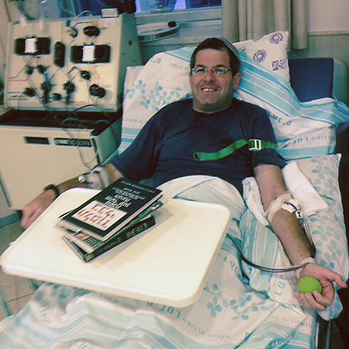 Shahar's father Shimon donating blood for his son.