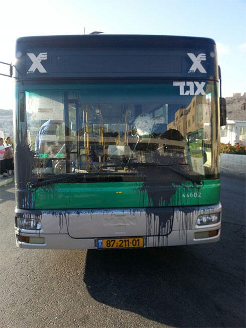 Damage caused to the bus from stones and paint bottle thrown at it.