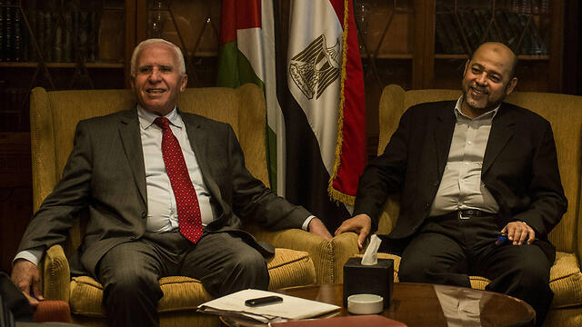 Fatah's Azzam al-Ahmad (L) negotiated with Hamas's Mousa Abu Marzook