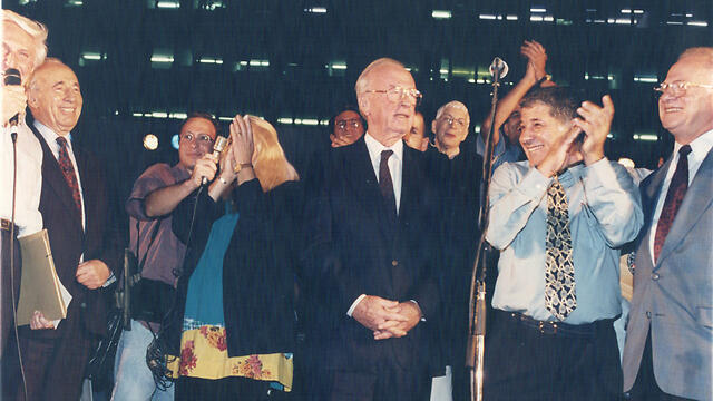Rabin, center, with Shimon Peres, 2nd left, and Shlomo Lahat, far left, on the night of his murder (Photo: Michal Krammer) 
