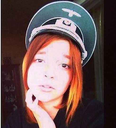 One of the "Miss Ostland" contestants wearing a Nazi hat 