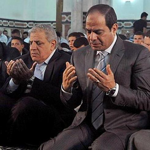 Ibrahim Mehleb (L) praying with Egyptian President Sisi (R) (Photo: AP) (Photo: AP) Ibrahim Mehleb (L) praying with Egyptian President Sisi (R) (Photo: AP)
