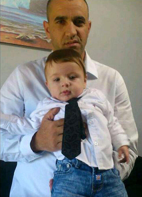 Jaddan Assad was killed in the attack, shown here with his son. (Photo: Assad family)