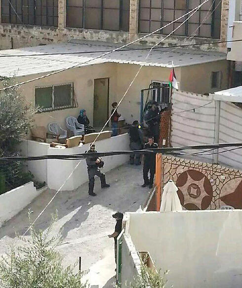 Israeli police take measurments at home of terrorist's family who stabbed and killed Dalia Lemkus on Monday. 