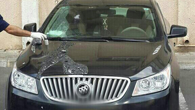 The car damaged in the acid attack (Photo: Israeli police sources)