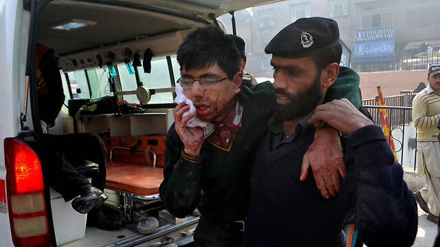 Wounded student is rescued (Photo: AP)