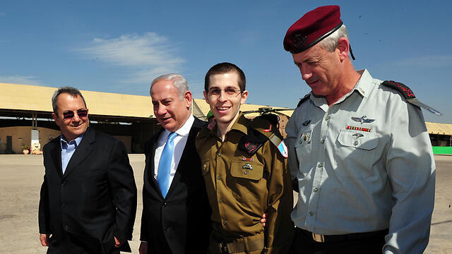 L to R: then-Def. Min. Ehud Barak, PM Benjamin Netanyahu, released soldier Gilad Shalit and IDF Chief of Staff Benny Gantz, upon Shalit's return from captivity