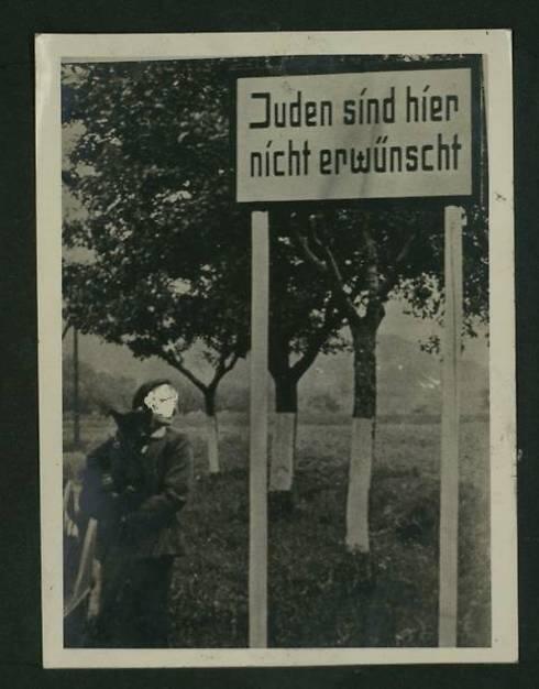 Jews are not welcome here, written on a sign in a wooded area (Photo courtesy of the National Library) 