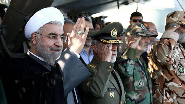 Iran's President Rouhani with army top brass (Photo: EPA) (צילום: EPA) Iran's President Rouhani with army top brass (Photo: EPA)