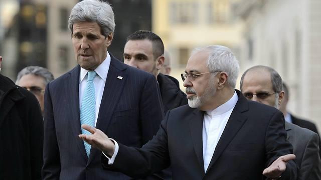 US Secretary of State John Kerry with Zarif in Geneva in January (Photo: Associated Press)