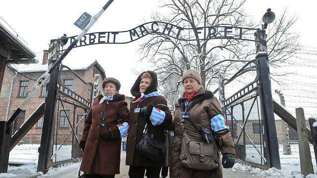 Holocaust survivors at Auschwitz. Site had a record 1.5 million visitors last year (Photo: AP)