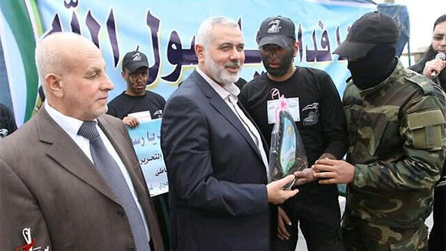 Hamas leader Ismail Haniyeh (center). The resources for Gaza's reconstruction should be given to the effective government in the Strip nullnull Hamas leader Ismail Haniyeh (center). The resources for Gaza's reconstruction should be given to the effective government in the Strip