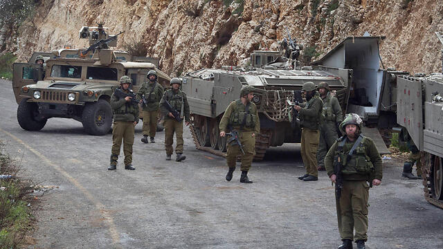 IDF vehicles near the border with Lebanon in January 2015 (Photo: Reuters) (צילום: רויטרס) IDF vehicles near the border with Lebanon in January 2015 (Photo: Reuters)