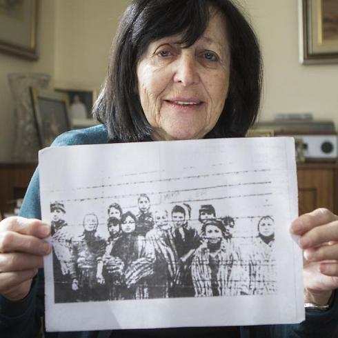 Marta Wise holds a famous photo that has become one of the most iconic images of the Holocaust (Photo: AP)