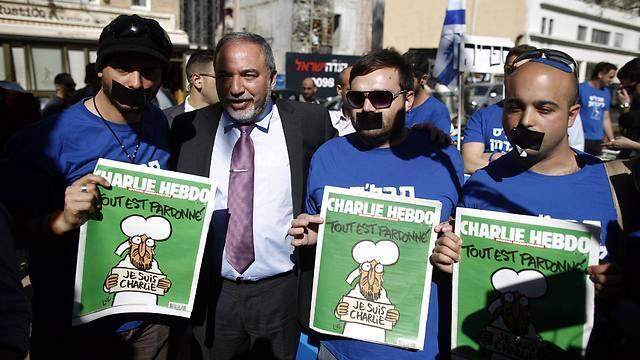Yisrael Beytenu activists: They will not shut our mouth (Photo: EPA)