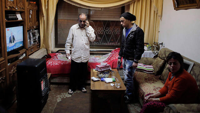 The Musallam famiy in their Jerusalem home (Photo: Reuters) (צילום: רויטרס) The Musallam famiy in their Jerusalem home (Photo: Reuters)